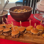 catering burgers on red tablecloth